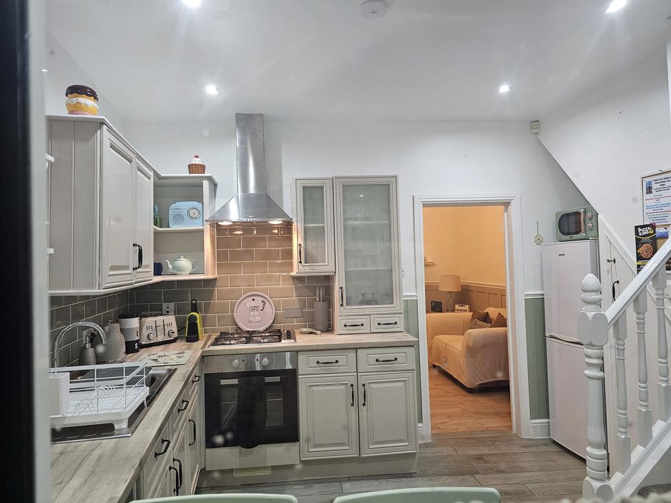 A kitchen with cabinets and a stove at Twisted Chimney View in Alford