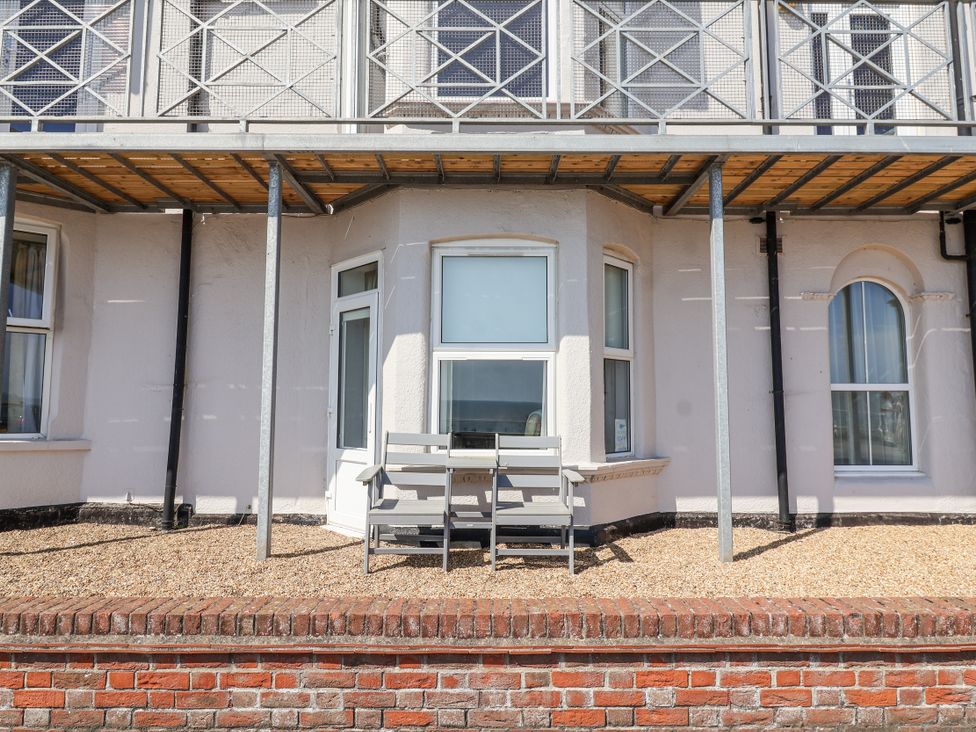 An outdoor area with gravel and a seating set at 11 The Craighurst Southwold