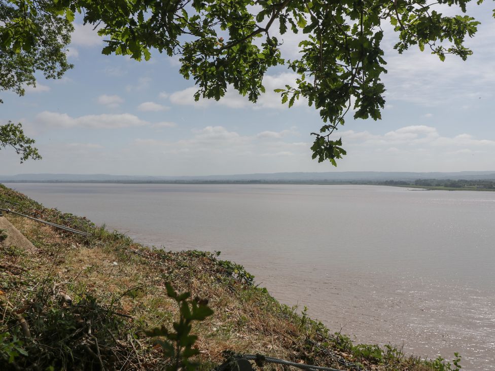 A view of a river and trees at Anvil Cottage Gatcombe near Blakeney