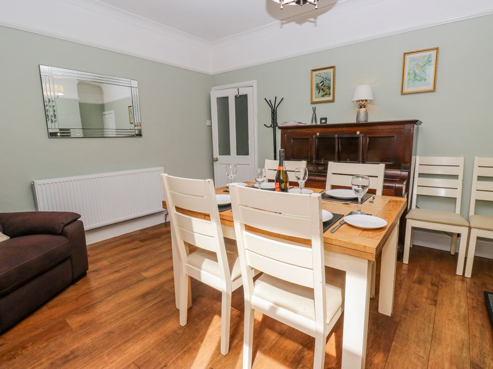 A dining room with a table and chairs at 49 Waddington Road Clitheroe