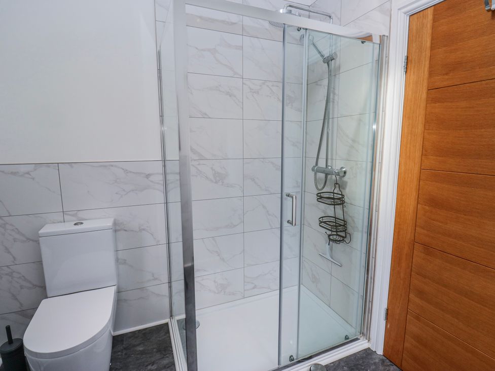 A bathroom with a shower and toilet at 49 Waddington Road in Clitheroe