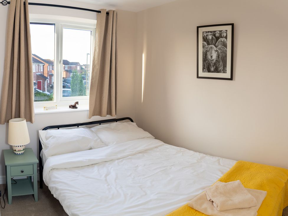 A bedroom with a bed and window at Deer Hill Grove York