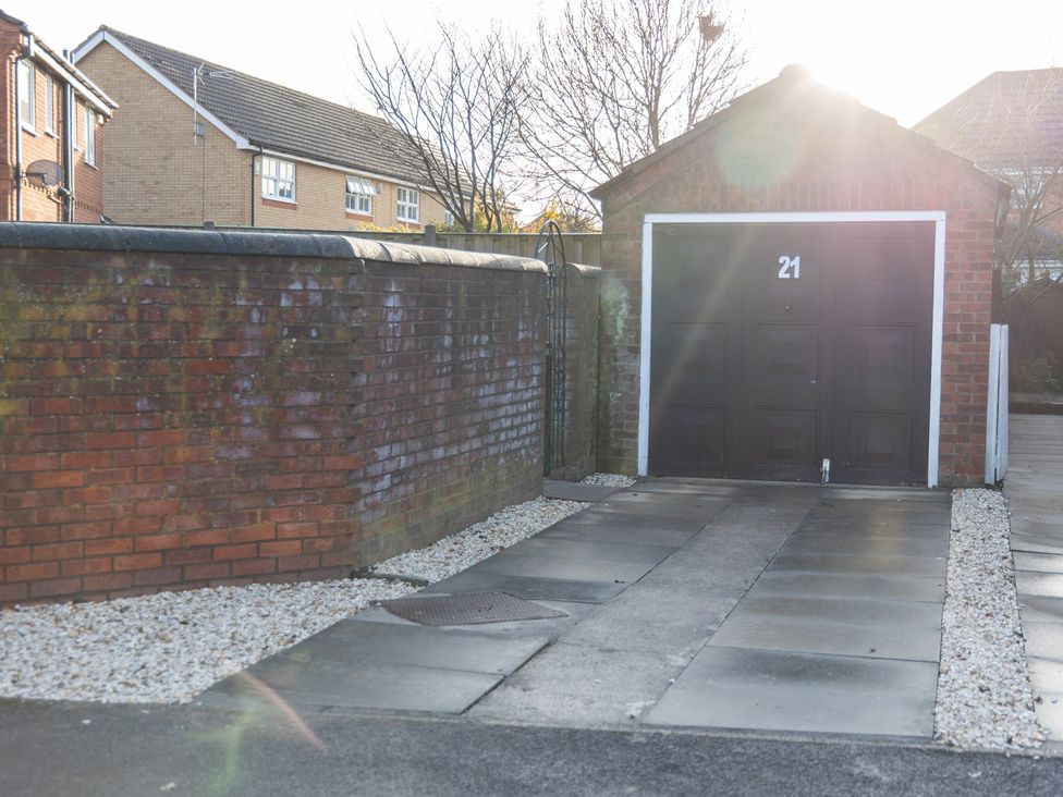 A garage with number 21 and a driveway at Deer Hill Grove in York