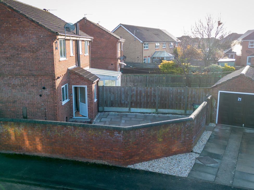 An outdoor area with a garage and driveway at Deer Hill Grove, York