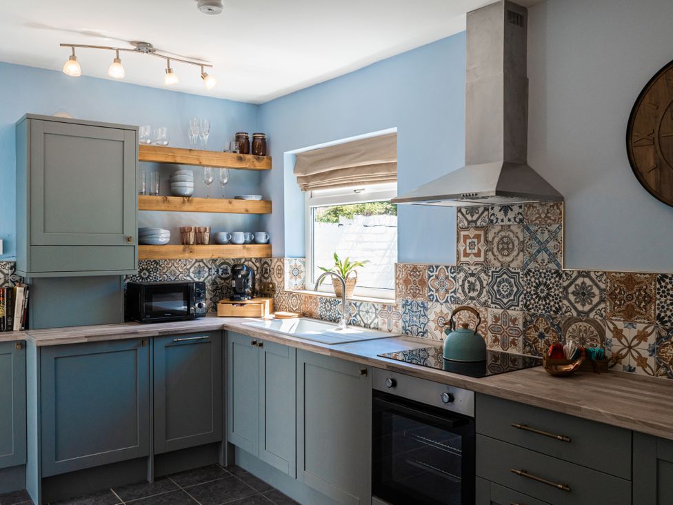 A kitchen with cabinetry and appliances at The George in Whitley Bay