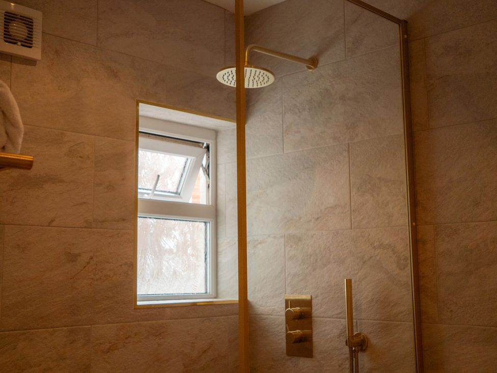 A bathroom with a shower and window at The George in Whitley Bay