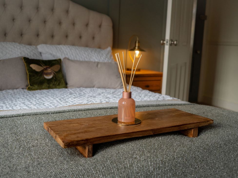 A bedroom with a bed and decorative items at The George in Whitley Bay