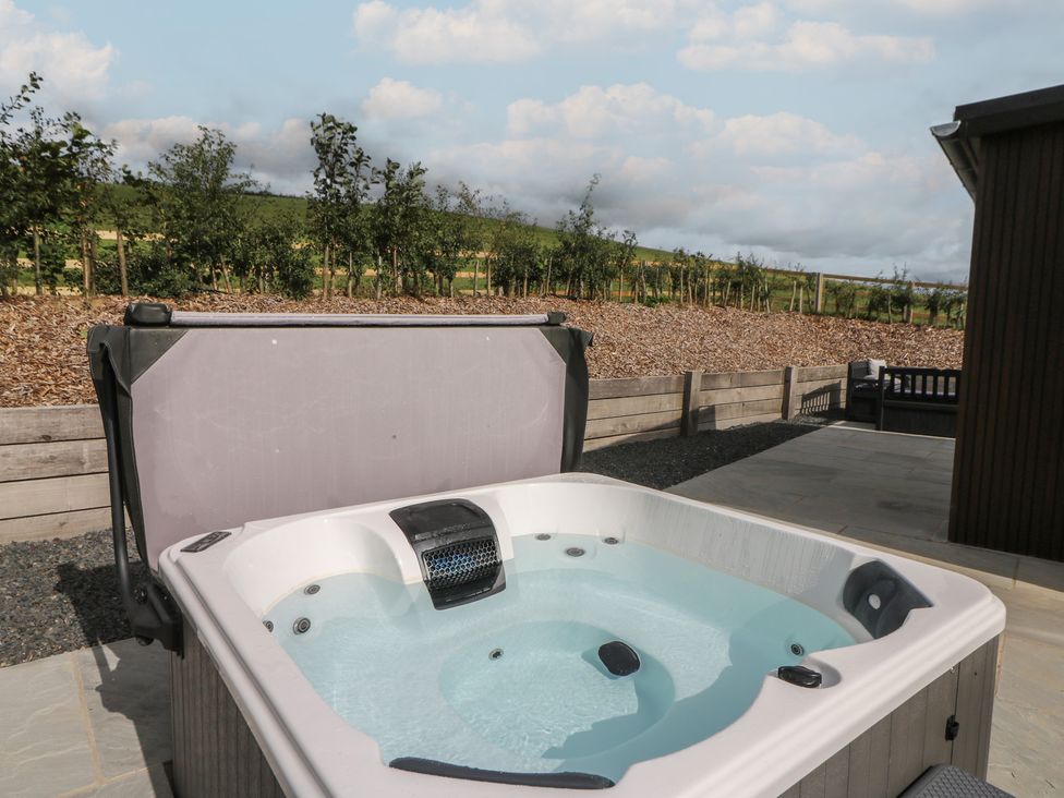 A hot tub in an outdoor area at Rydlan Aberystwyth