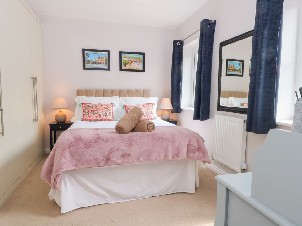 A bedroom with a bed and bedside table at Woodland View in Buxton