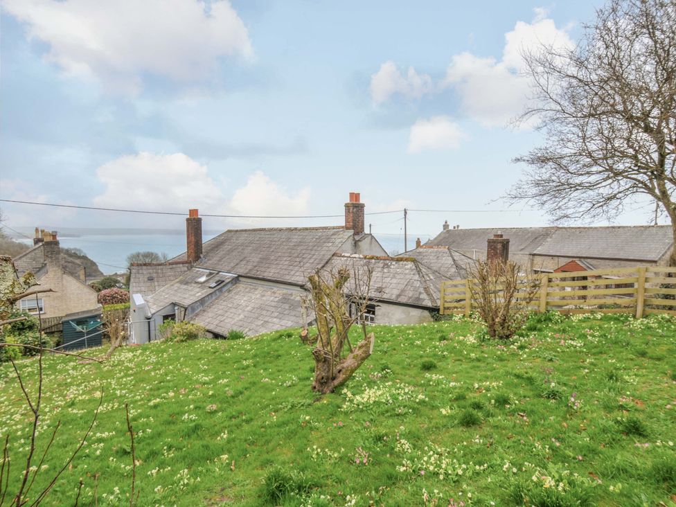 An outdoor view showing rooftops and grass at Jolly Crabber in Porthpean near St Austell