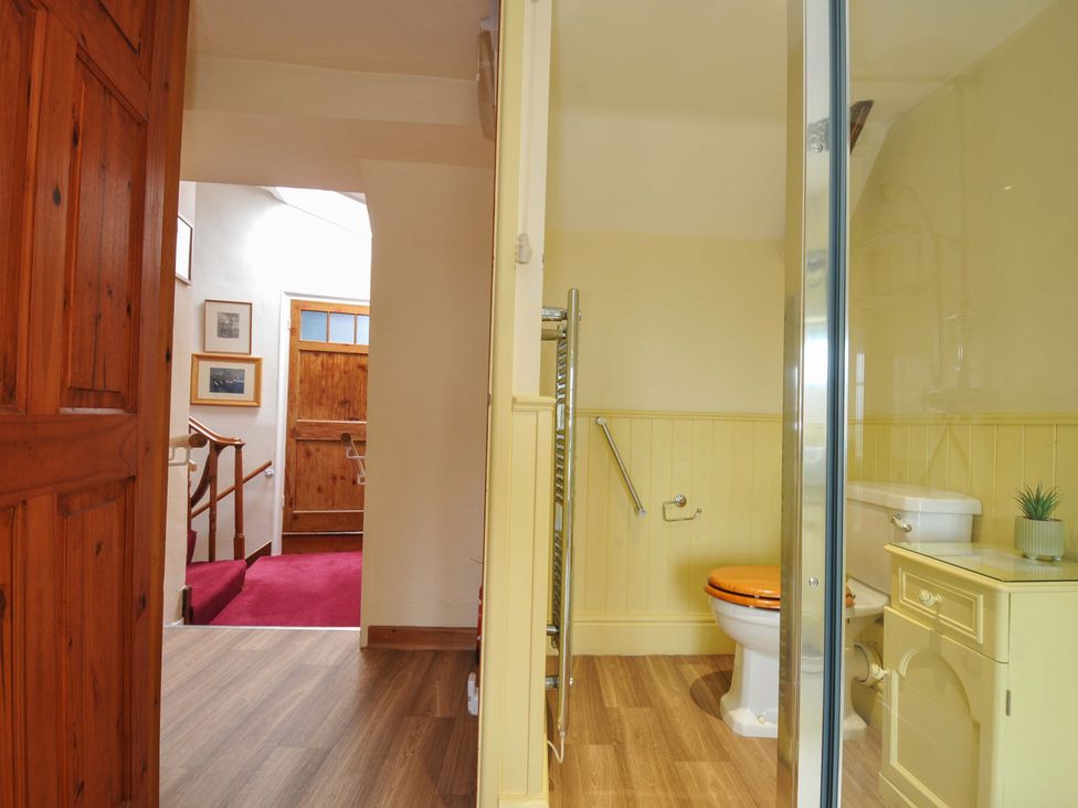 A bathroom with toilet and sink at Smugglers in Porthpean near St Austell