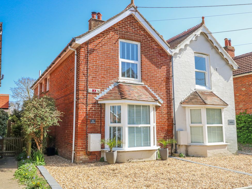 A house with windows and gravel at 4 Copse Lane in Freshwater