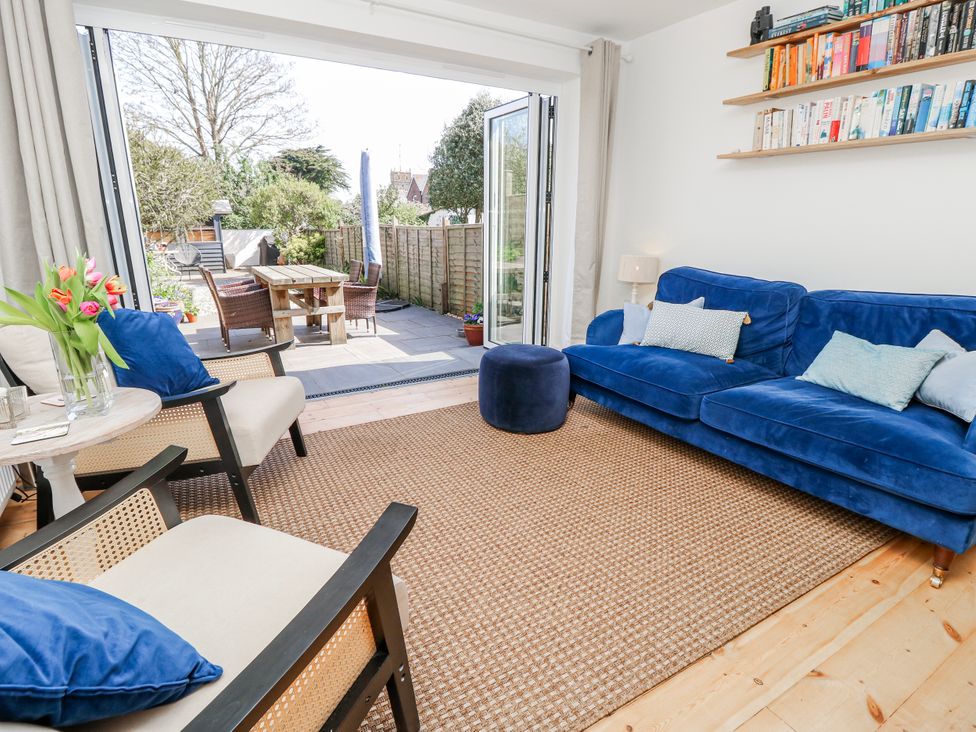 A living room with a sofa and coffee table at 4 Copse Lane in Freshwater