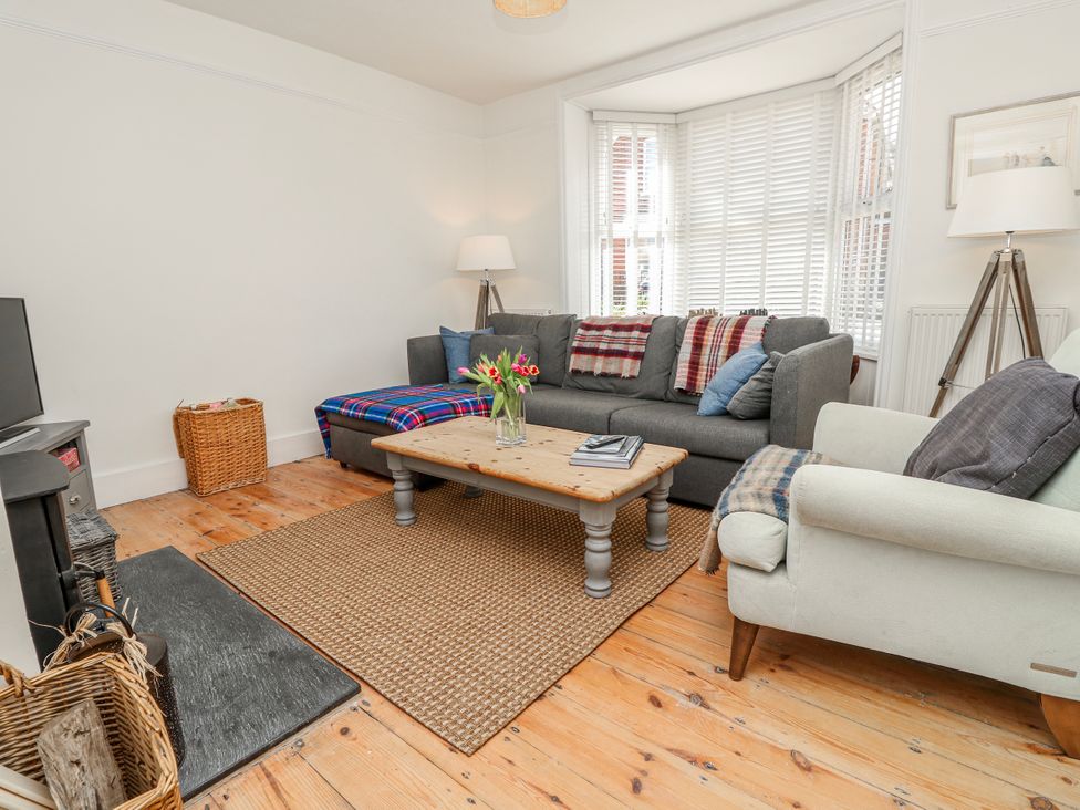 A living room with a sofa and coffee table at 4 Copse Lane Freshwater