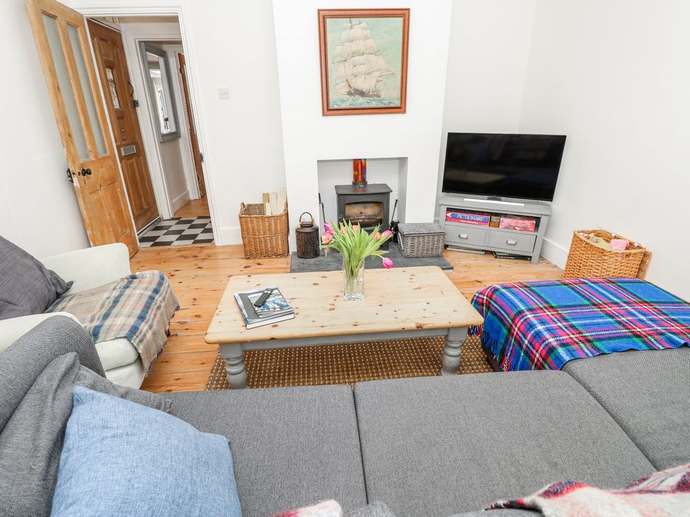A living room with a sofa and coffee table at 4 Copse Lane in Freshwater