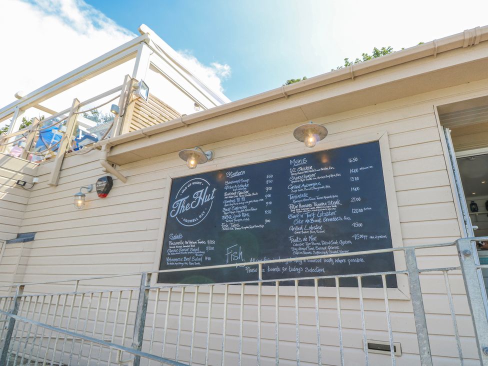 A menu board displayed at The Hut in Colwell Bay