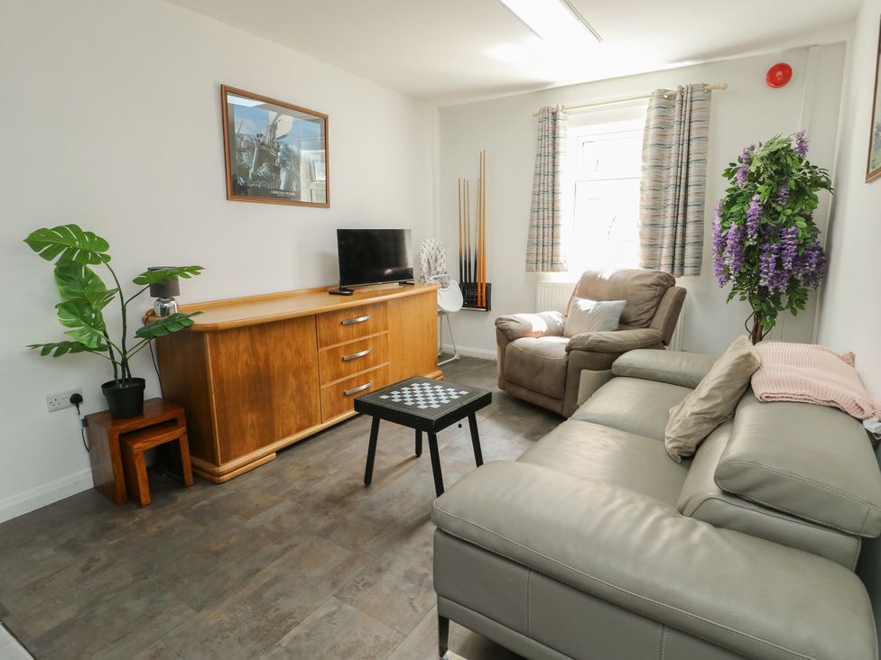 A living room with a sofa and coffee table at The Bevan in Bontnewydd, Gwynedd