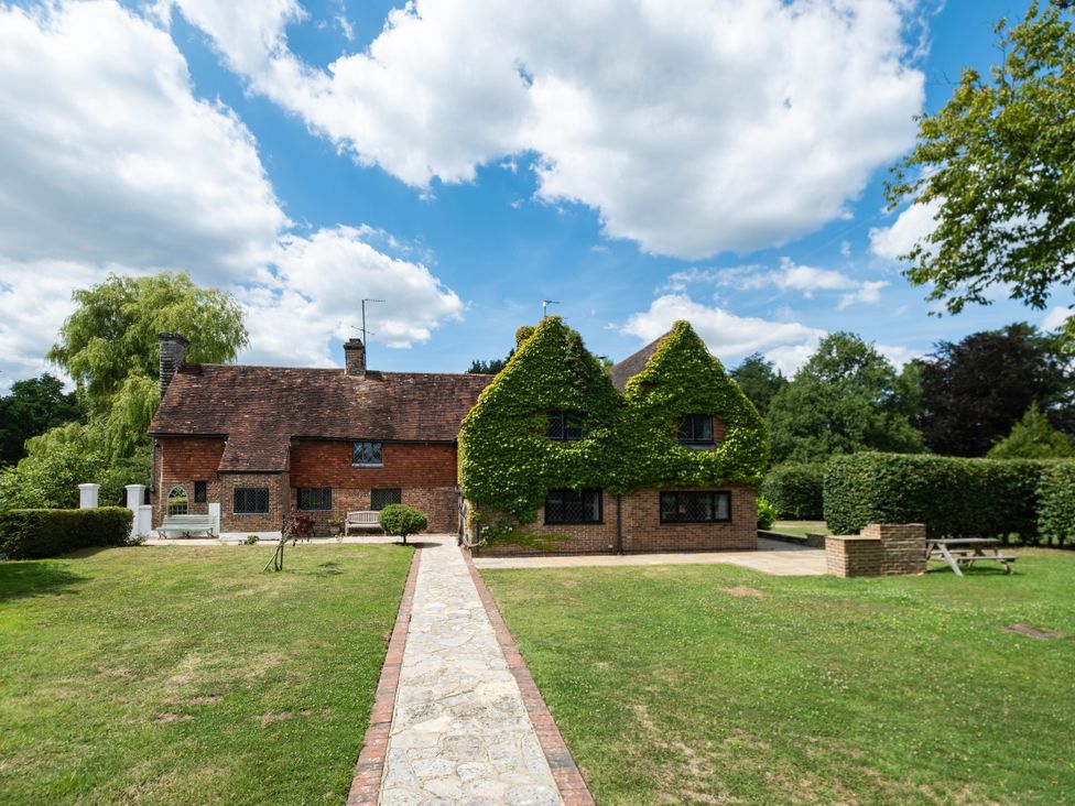 A house with a garden and pathway at Gildridge in Whitesmith near East Hoathly