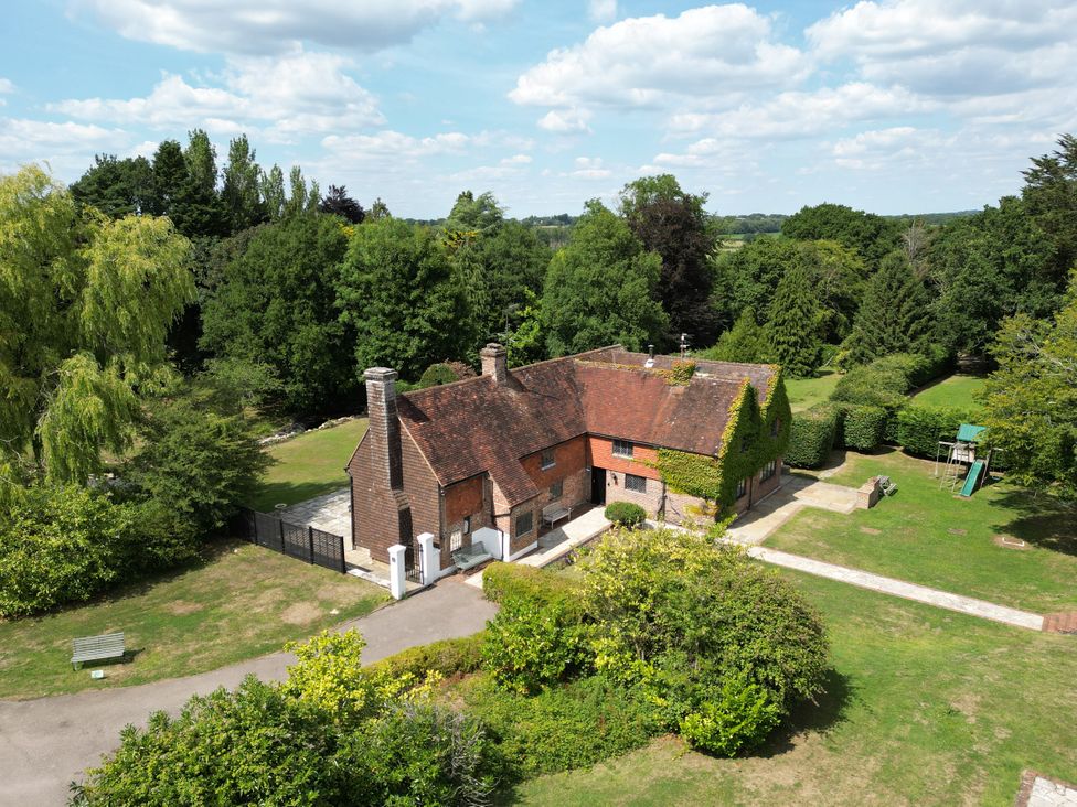 A house surrounded by trees and garden at Gildridge in Whitesmith near East Hoathly