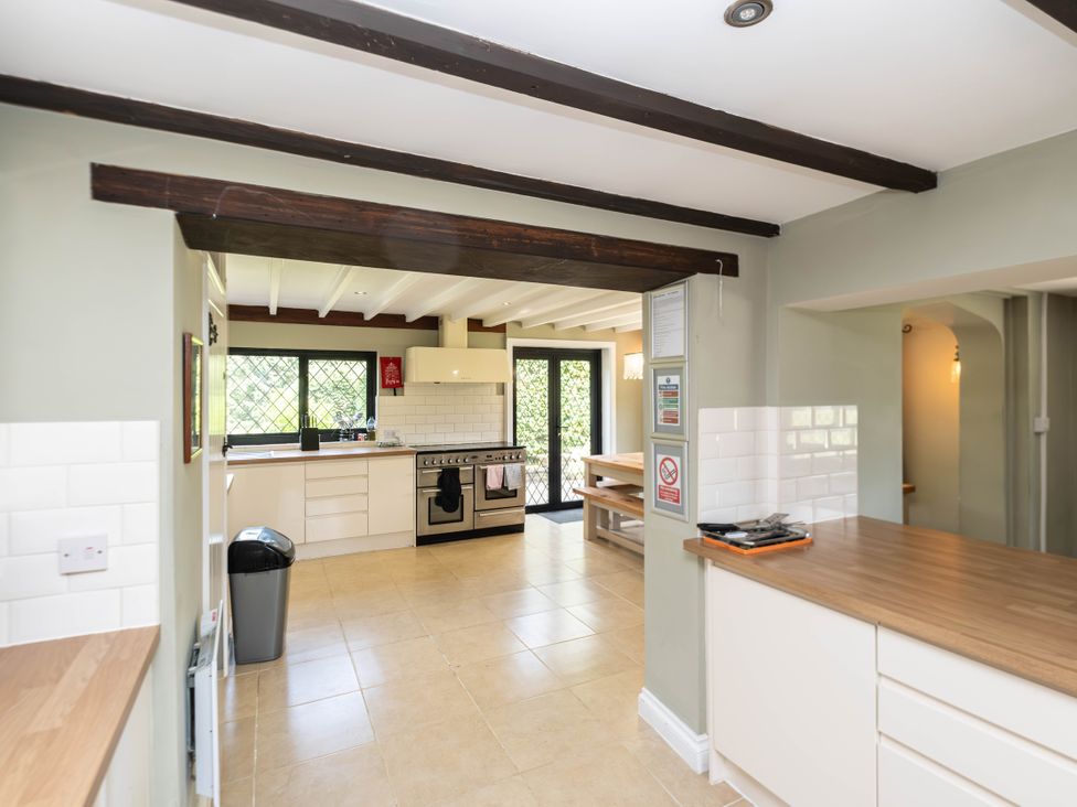 A kitchen with cabinets and a stove at Gildridge Whitesmith near East Hoathly
