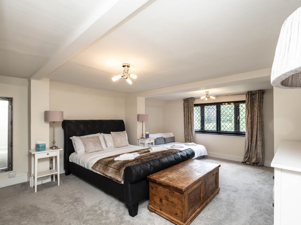 A bedroom with a bed and wooden chest at Gildridge in Whitesmith near East Hoathly