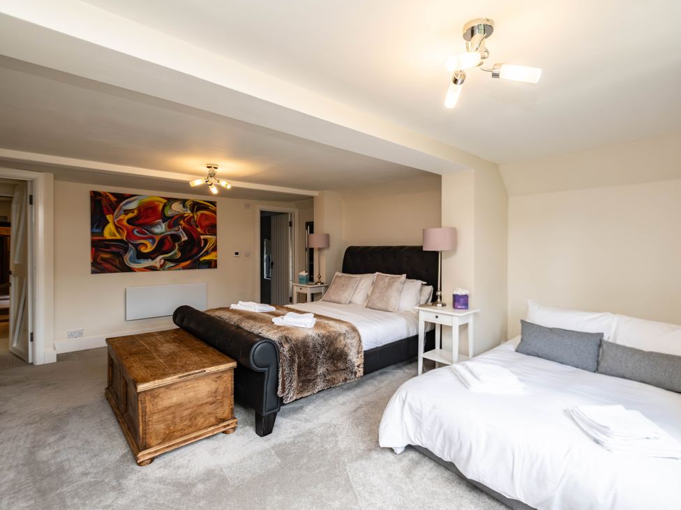 A bedroom with two beds and a wooden chest at Gildridge in Whitesmith near East Hoathly