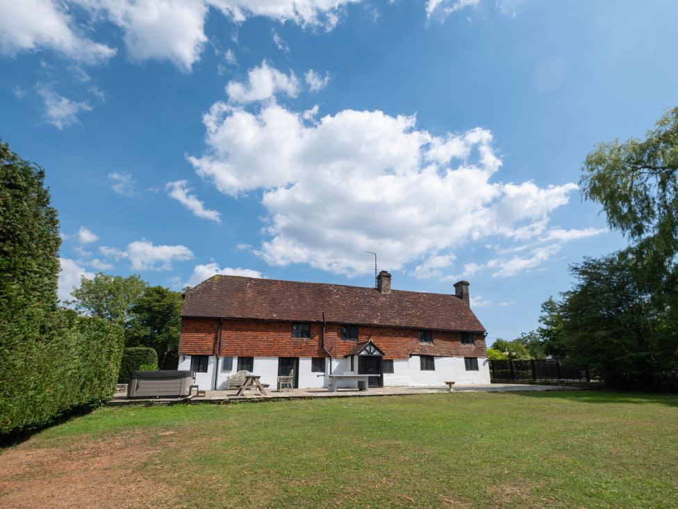 A house with a garden and trees at Gildridge in Whitesmith near East Hoathly