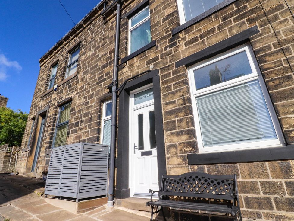 A building exterior with a door and windows at 4 Green Street in Keighley