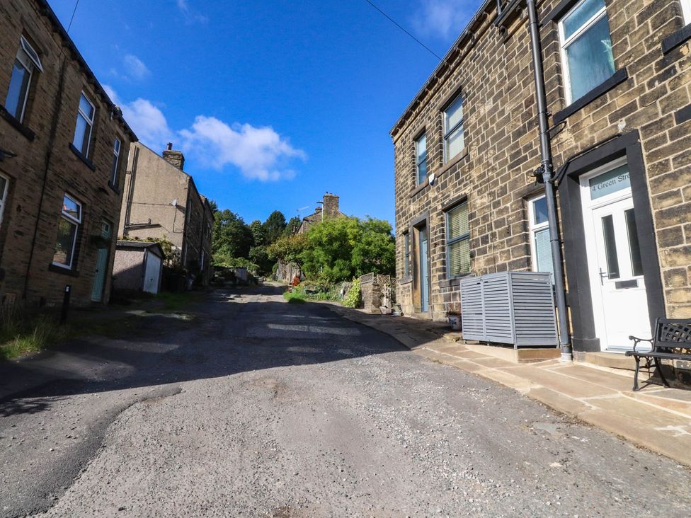 A gravel road with buildings on either side at 4 Green Street Keighley