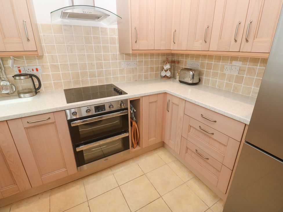 A kitchen with an oven, hob and accessories at Flat 2, Moonrakers in St. Ives