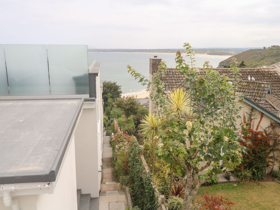 An outdoor view of houses and ocean at Flat 2, Moonrakers St. Ives