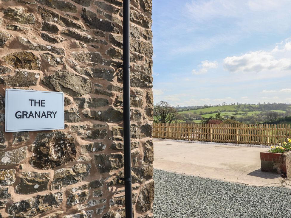 An outdoor area with a view of the landscape at The Granary Llangyniew near Llanfair Caereinion