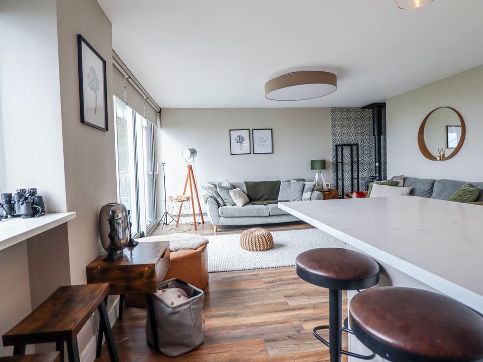 A living room with a couch and coffee table at Hafod Y Bryn Harlech
