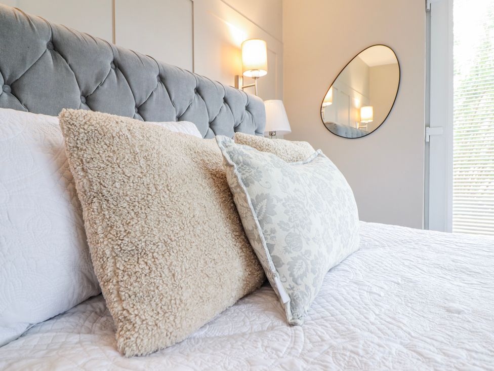 A bedroom with pillows on a bed at Hafod Y Bryn in Harlech