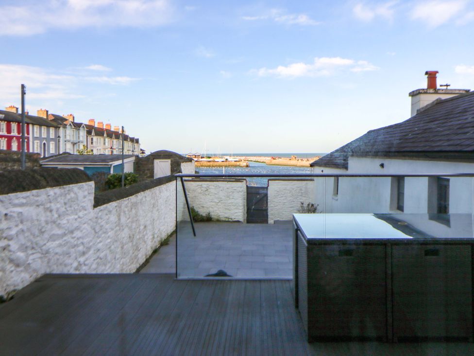 An outdoor view with houses and sea at Island House Aberaeron