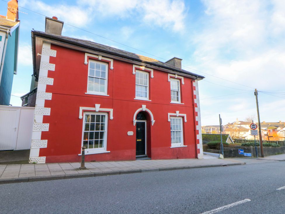 A house with red exterior and windows at Island House in Aberaeron