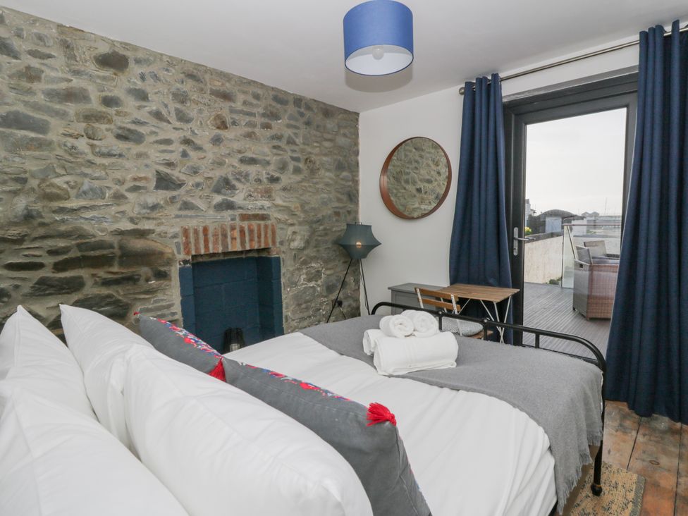 A bedroom with a bed and a view at Island House in Aberaeron