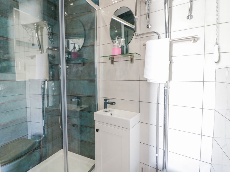 A bathroom with a shower and sink at Island House Aberaeron