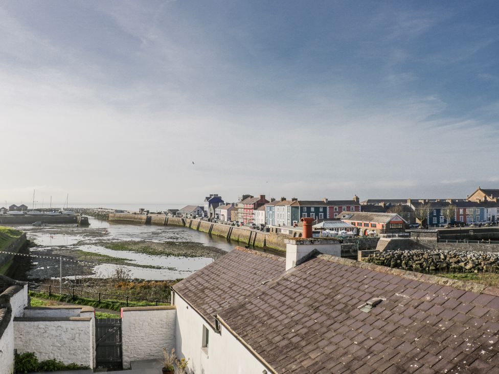 A view of a harbor and colorful houses at Island House in Aberaeron