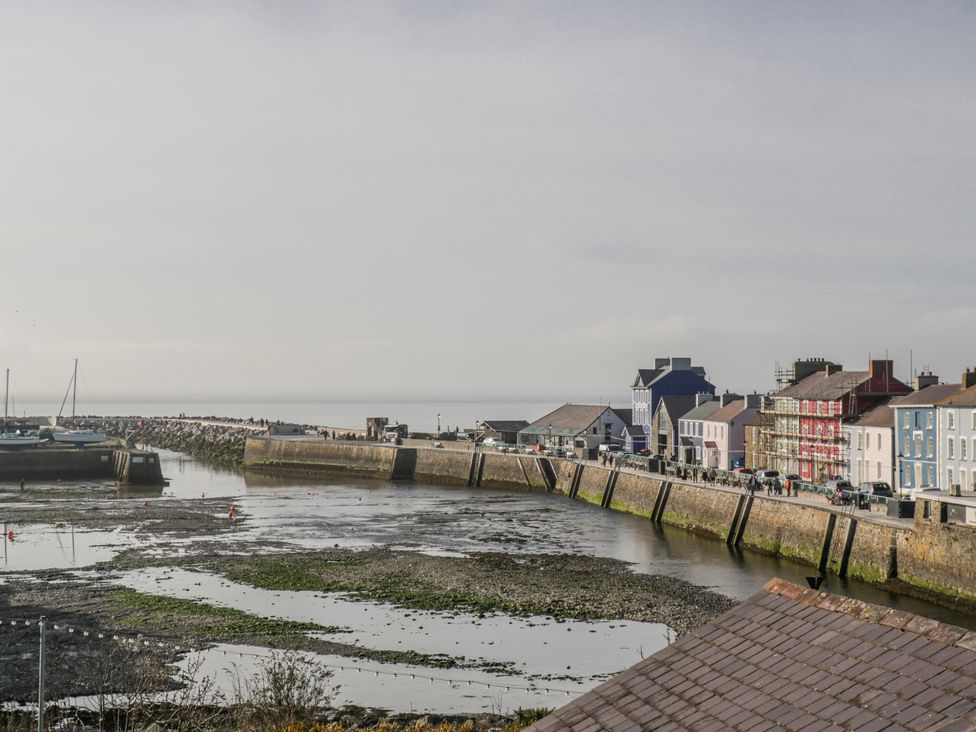 A harbor with boats and buildings at Island House in Aberaeron