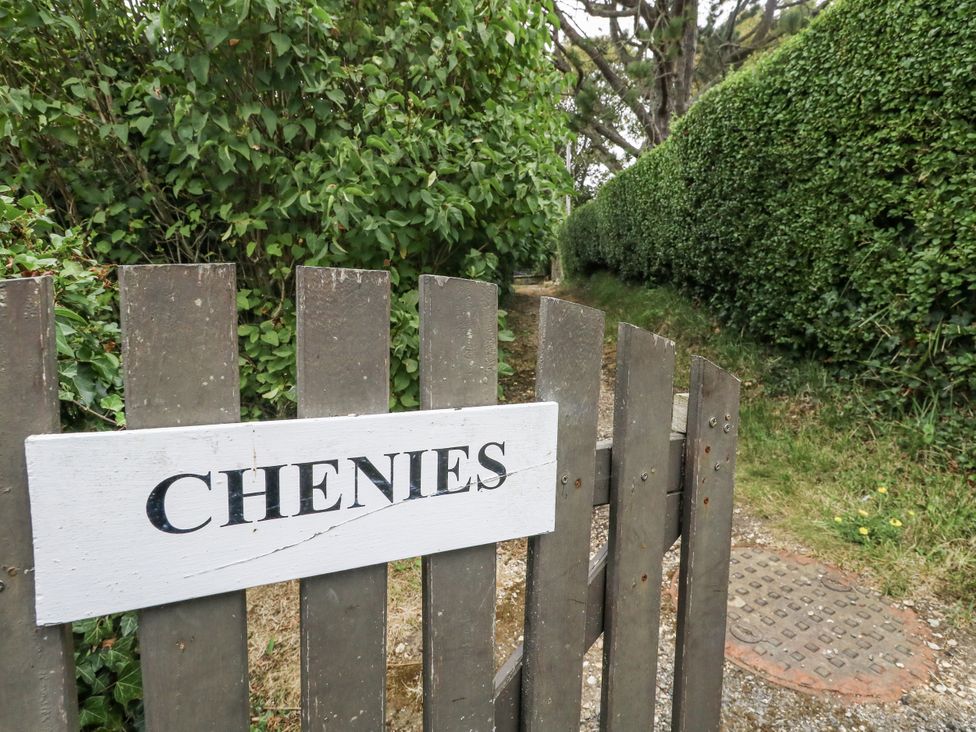 A gate with a sign reading 'Chenies' leading to a path at Chenies, Osmington Mills, near Preston
