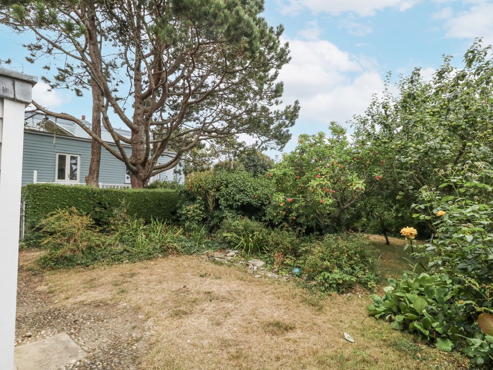 A garden with trees and bushes at Chenies, Osmington Mills, near Preston