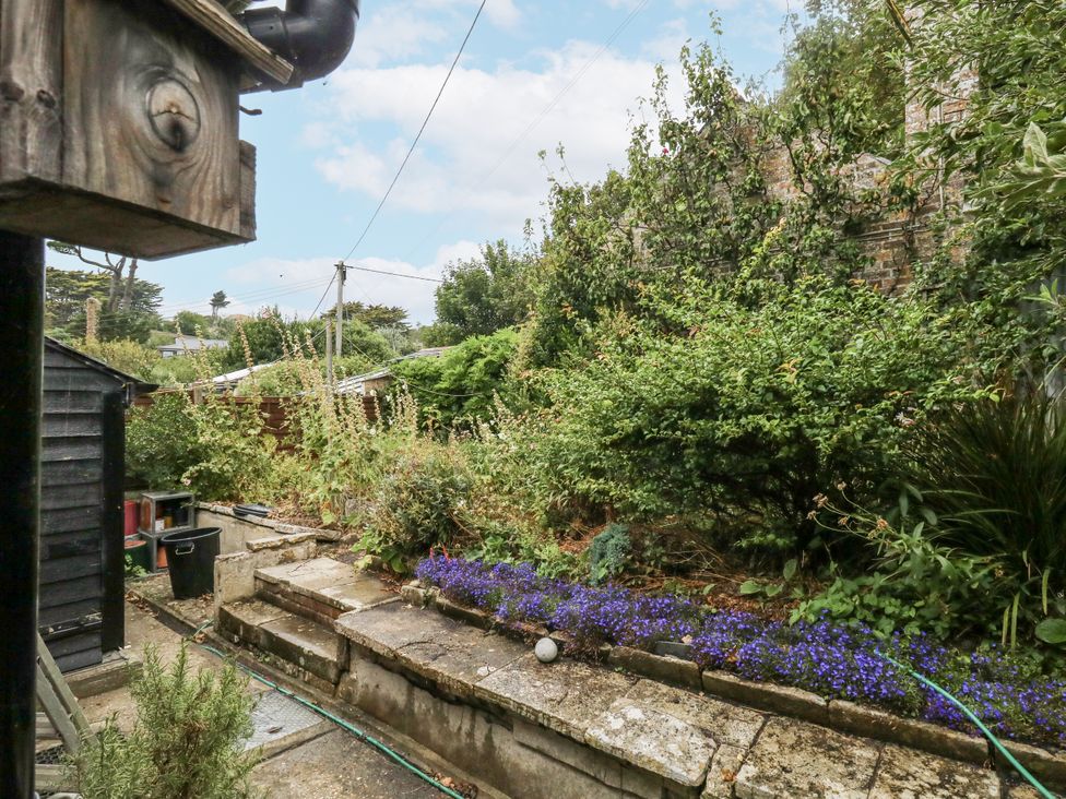 A garden with pathways and flower beds at Chenies, Osmington Mills, near Preston