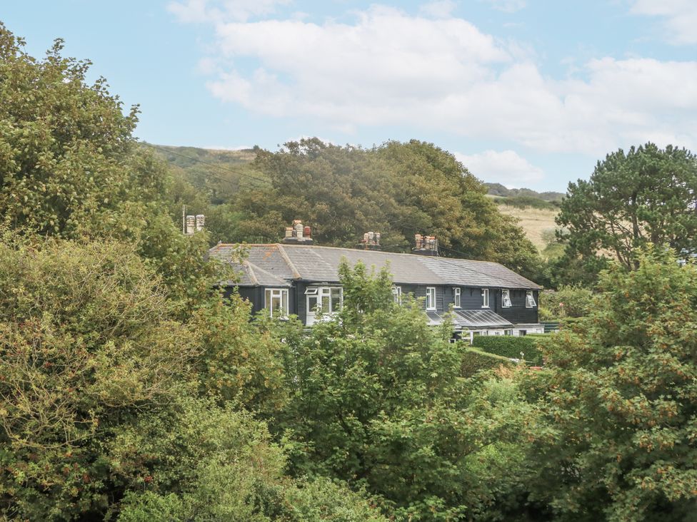 A house surrounded by trees at Chenies in Osmington Mills, near Preston