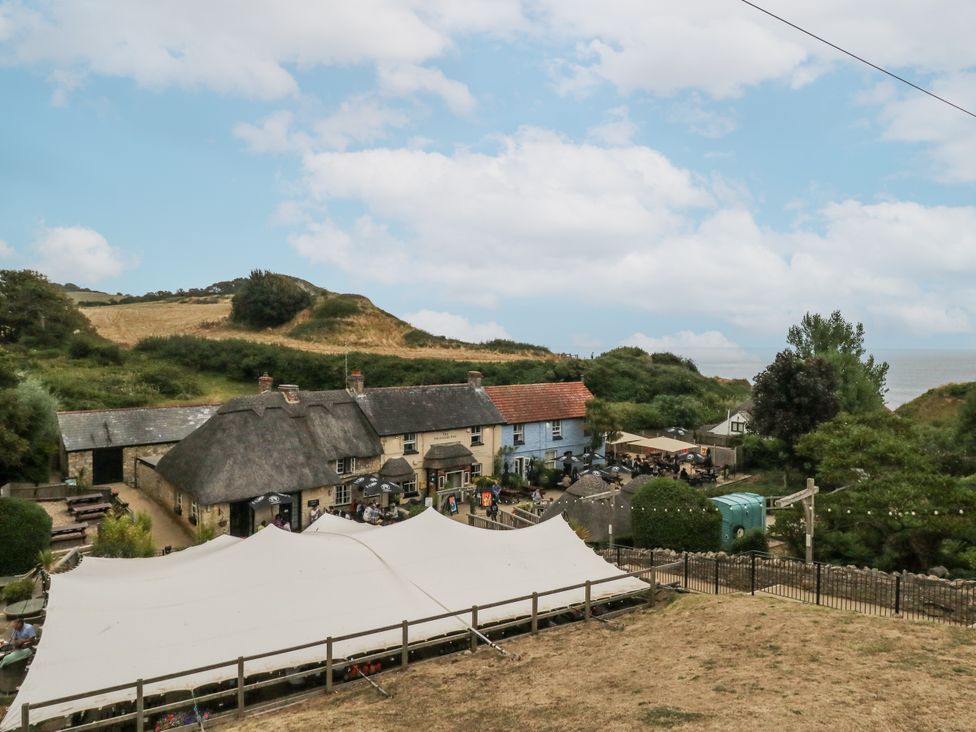 An outdoor area with houses and a tent at Chenies, Osmington Mills, near Preston