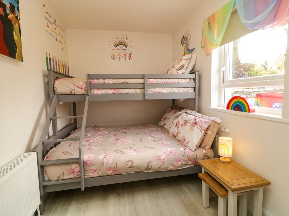 A bedroom with a bunk bed and decorative items at Duffy Lodge Kilmacloo near Creeslough, County Donegal