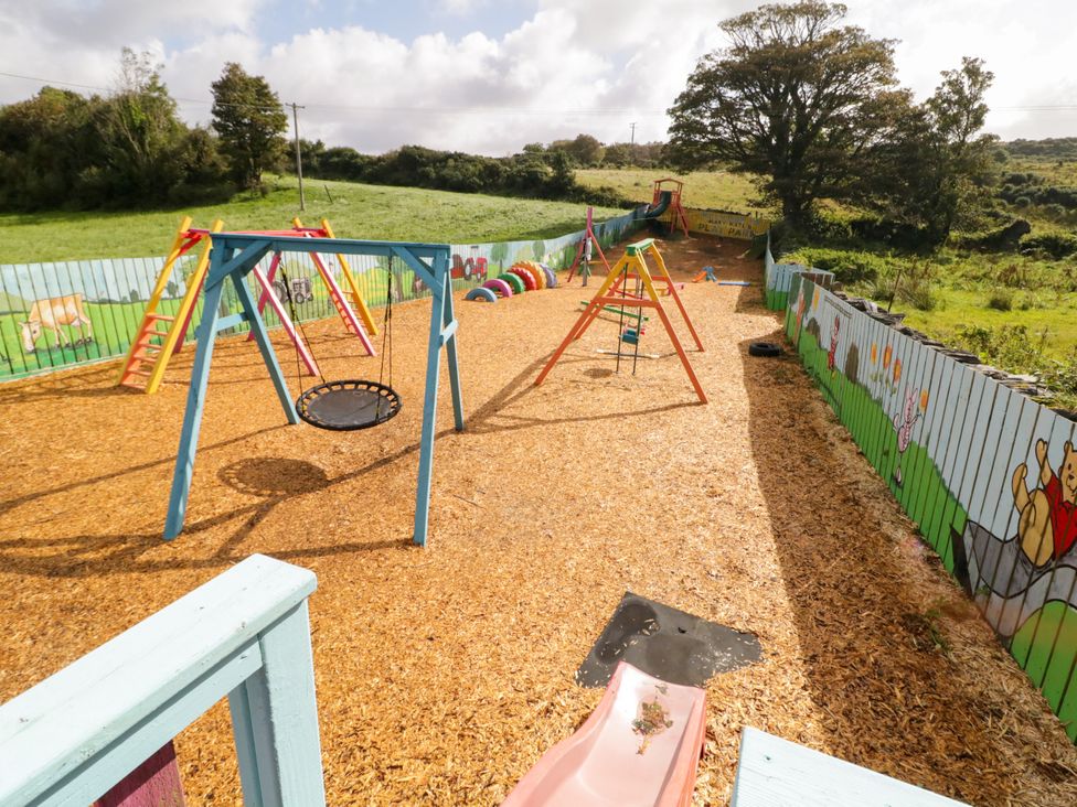 A playground with swings and a slide at Duffy Lodge Kilmacloo near Creeslough, County Donegal