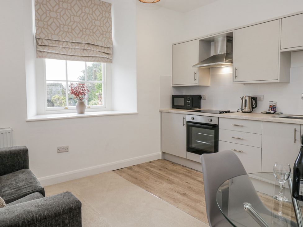 A kitchen with appliances and furniture at Ullswater in Ulverston