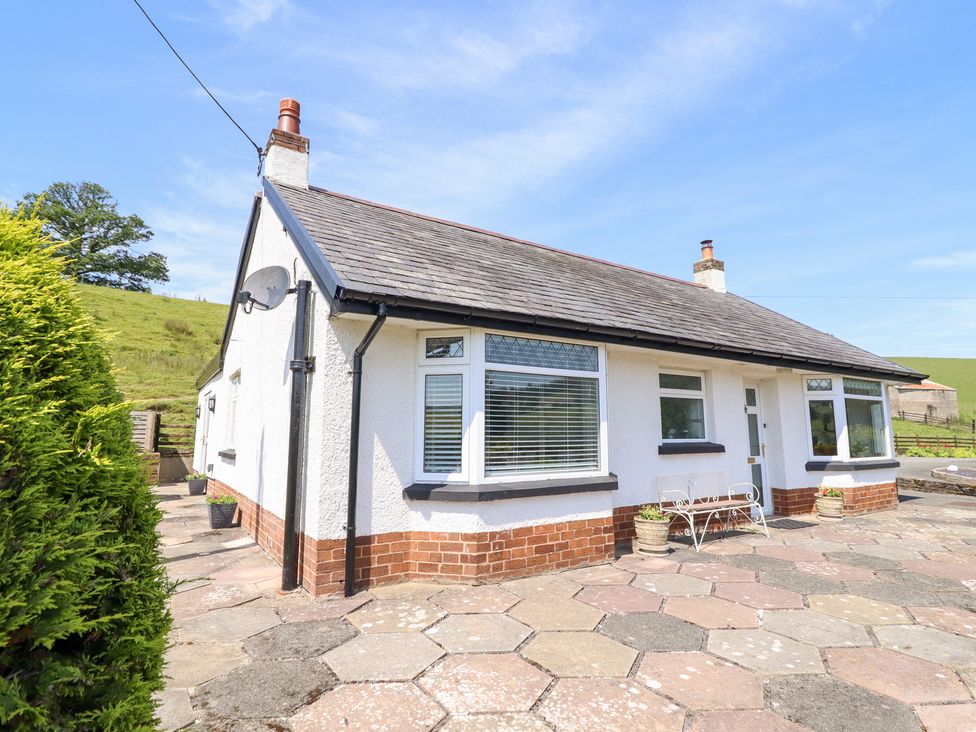 A house with windows and a pathway at Bryn Bras in Corwen