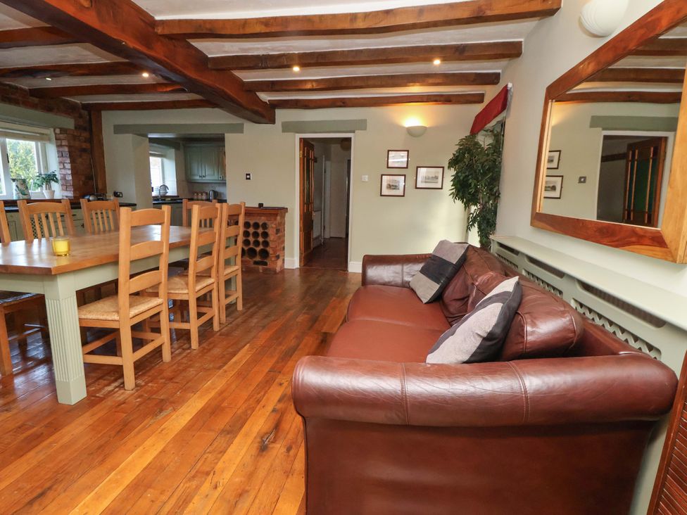 A dining room with a table and chairs at Home Farm St Asaph